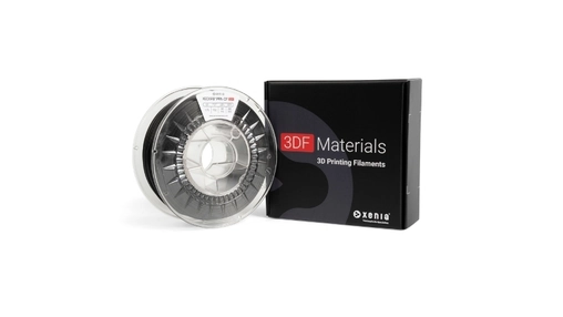 Spool of dark thermoplastic filament next to a black 3DF Materials packaging box with the Xenia logo